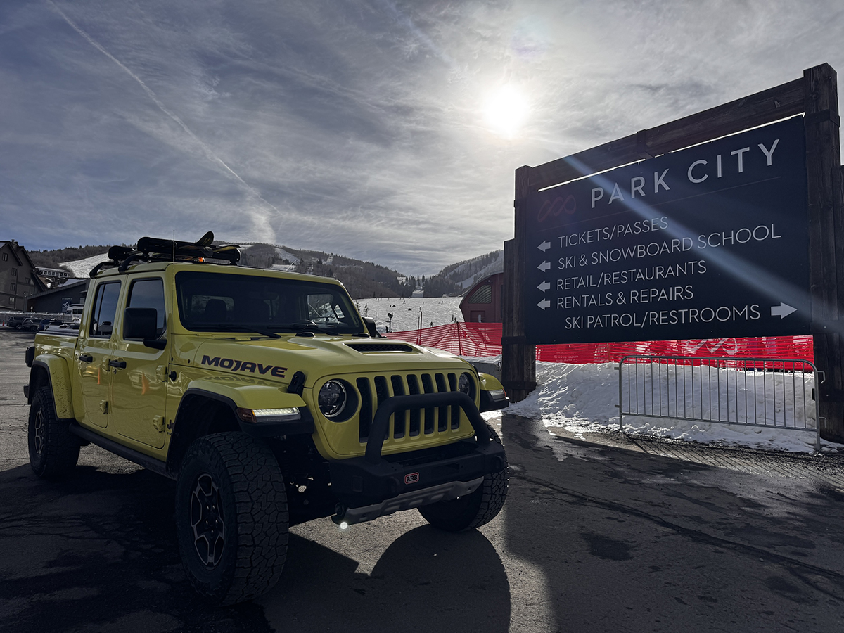 Yellow gladiator next to Park City Road Sign